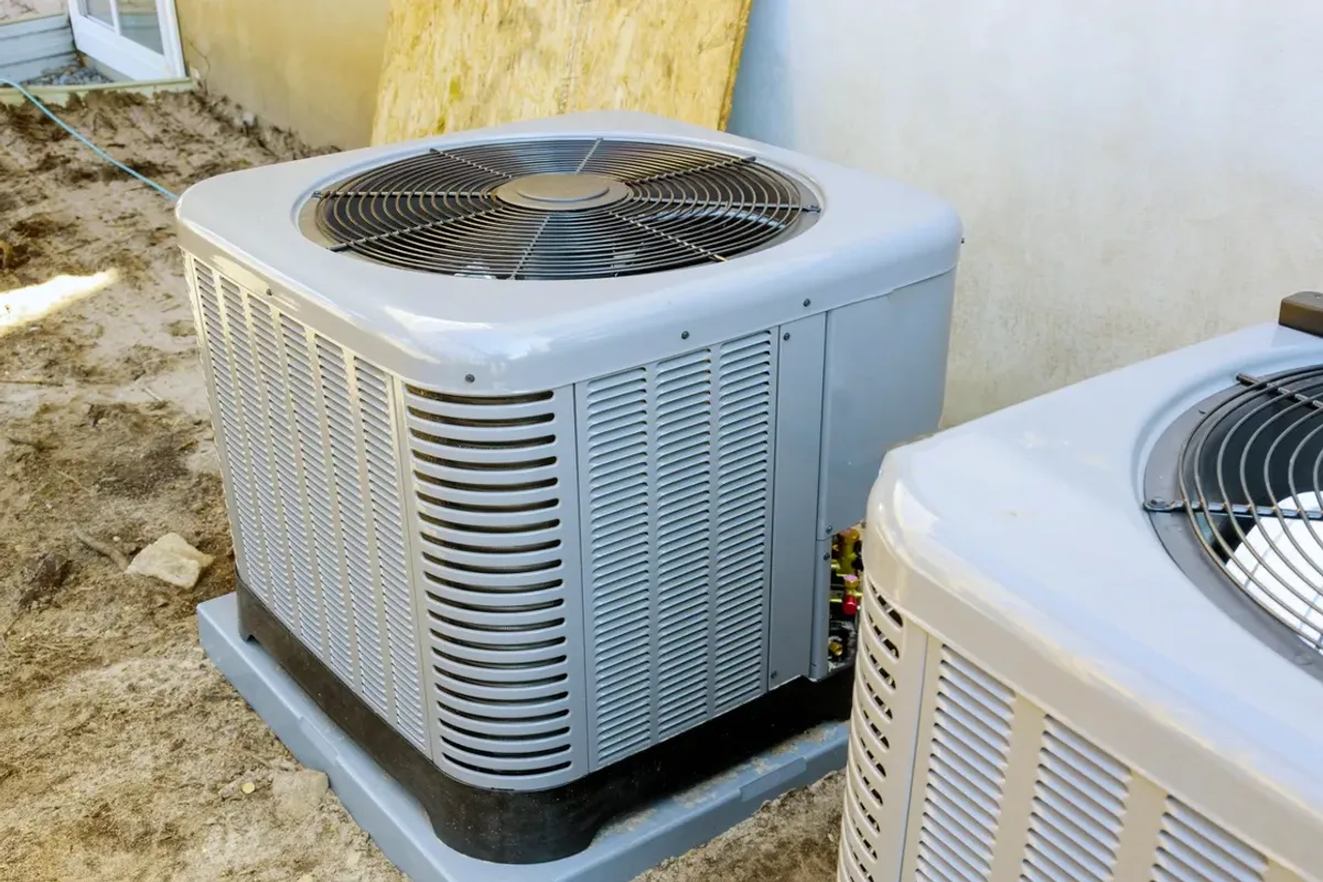 Two outdoor air conditioner condensers