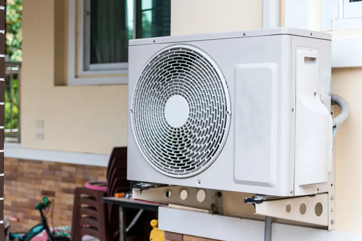 Outdoor heat pump unit on a wall bracket